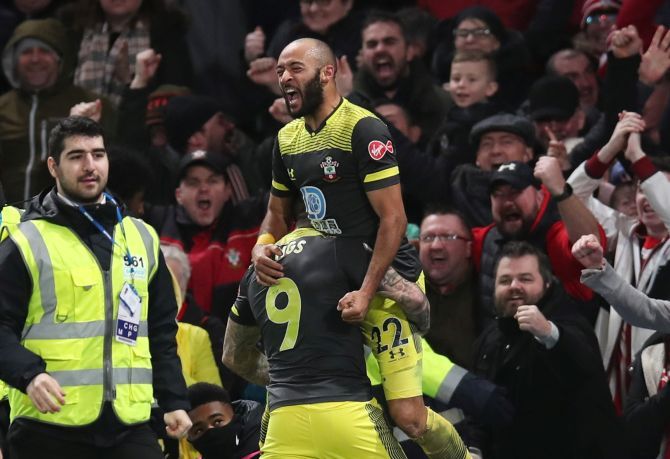 Southampton's Nathan Redmond celebrates with teammates after scoring their second goal against Chelsea at Stamford Bridge