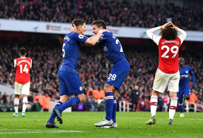 Chelsea's Jorginho celebrates with teammate Cesar Azpilicueta after scoring