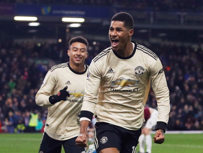 Manchester United's Marcus Rashford celebrates with Jesse Lingard after scoring their second goal against Burnley at Turf Moor in Burnley on Saturday