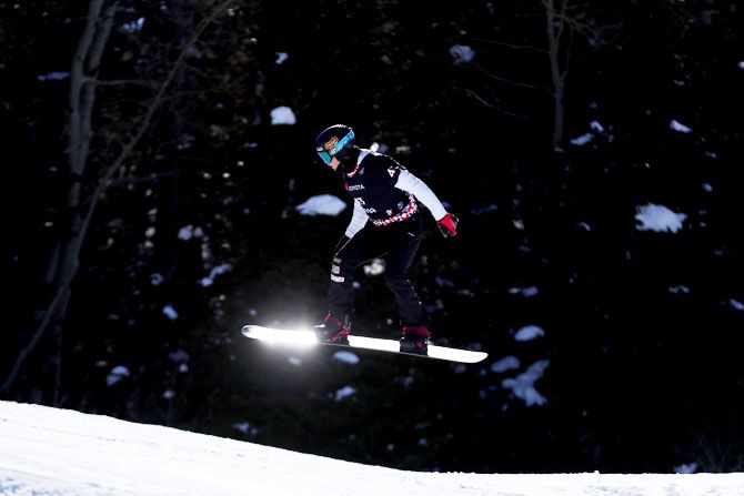 USA's Nick Baumgartner competes in the Men's Snowboard Cross Qualifiers on Thursday