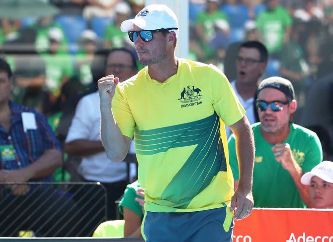 Australia captain Lleyton Hewitt celebrates as John Millman of Australia wins the first set during his rubber 1 singles match against Damir Dzumhur of Bosnia / Herzegovina on Friday. 'Lleyton is right to say Bernard will not be considered for Davis Cup. Bernard does not meet the standards of behaviour and commitment to himself, the team or the sport'