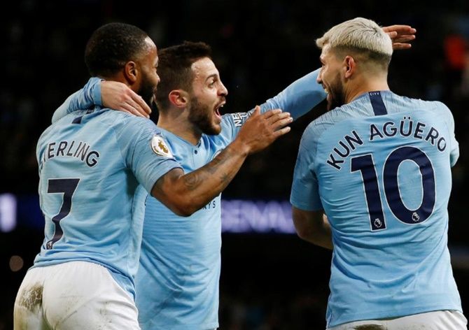 Manchester City's Sergio Aguero celebrates with Raheem Sterling and Bernardo Silva