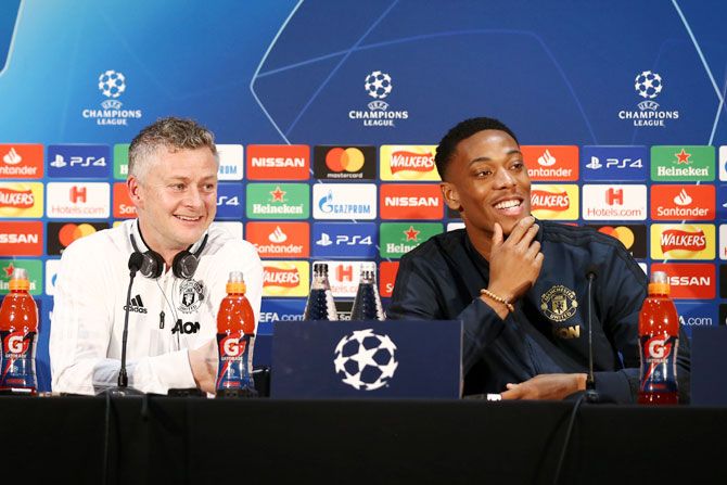 Manchester United's interim Manager Ole Gunnar Solskjaer and forward Anthony Martial at a press conference ahead of their UEFA Champions League Round of 16 match against Paris Saint-Germain at Aon Training Complex in Manchester, on Monday