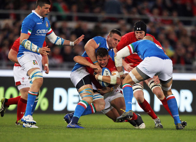 Wales' Elliot Dee is tackled by Italy's Abraham Steyn during the Guinness Six Nations match at Stadio Olimpico in Rome on Saturday, February 9