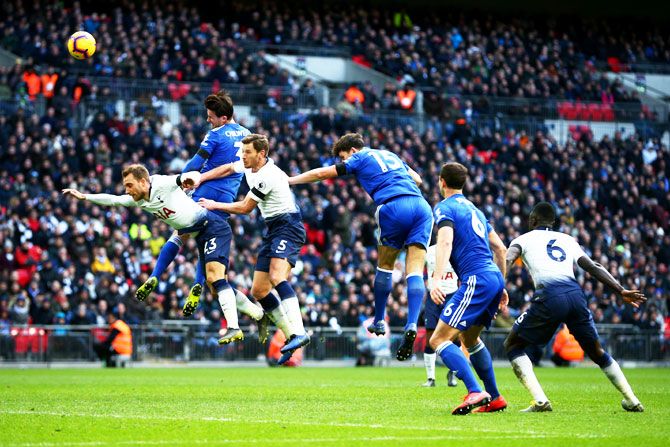 Leicester City's Ben Chilwell heads towards goal as he is challenged by Tottenham Hotspur's Jan Vertonghen and Christian Eriksen during their English Premier League match at Wembley Stadium in London on Sunday, February 10