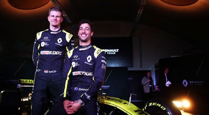 Renault Sport F1's Australian driver Daniel Ricciardo (right) and German driver Nico Hulkenberg, pose with the Renault Sport F1 RS19 during the Renault Sport Formula One Team 2019 car launch in Enstone, England, on Tuesday