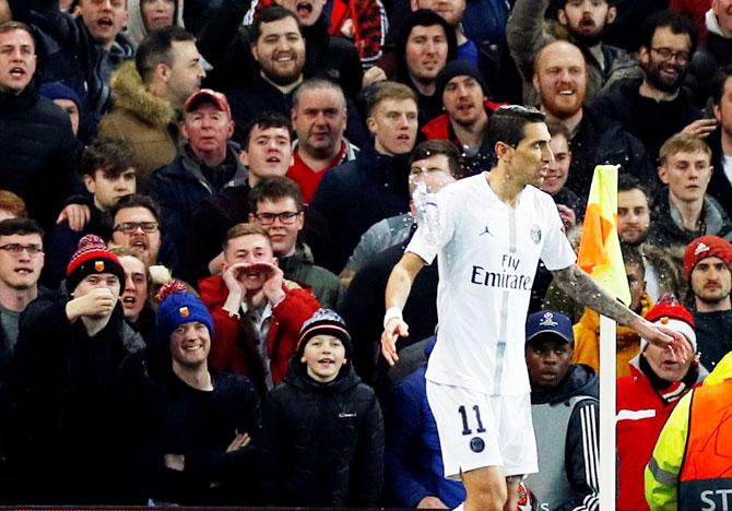 A bottle is thrown at Paris St Germain's Angel Di Maria during the Champions League match against Manchester United at Old Trafford on Tuesday, February 12