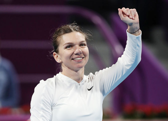 Romania's Simona Halep celebrates winning her Qatar Open round of 16 match against Ukraine's Lesia Tsurenko at Khalifa International Tennis and Squash Complex, Doha, on Wednesday