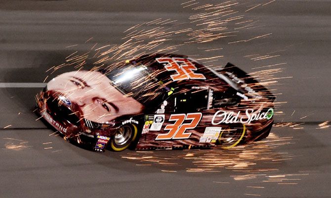 NASCAR Cup Series driver Corey LaJoie (32) gets a front end full of sparks from driver Casey Mears (not pictured) in turn four during the Gander RV Duel 2 at Daytona International Speedway at Daytona Beach, Florida, during the NASCAR Cup on Thursday, February 14