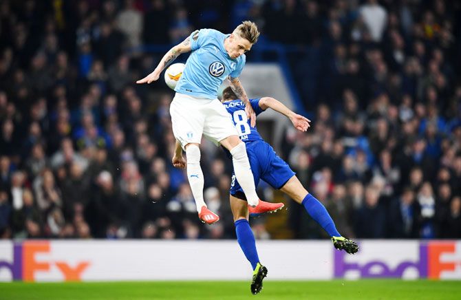 Malmo's Soren Rieks challenges for the ball with Chelsea's Cesar Azpilicueta during their Round of 32 second leg Europa League match at Stamford Bridge in London on Thursday, February 21