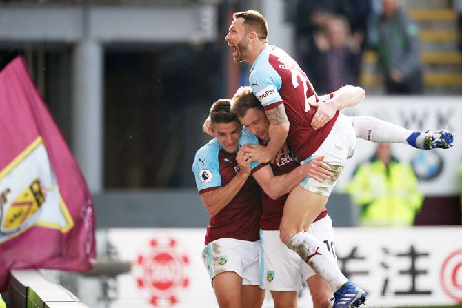 Burnley's Ashley Barnes celebrates with teammates after scoring their second goal against Tottenham Hotspur at Turf Moor in Burnley on Saturday