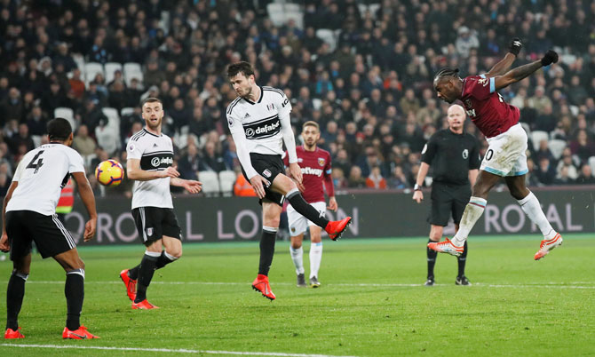 West Ham's Michail Antonio scores their third goal against Fulham at London Stadium in London on Friday