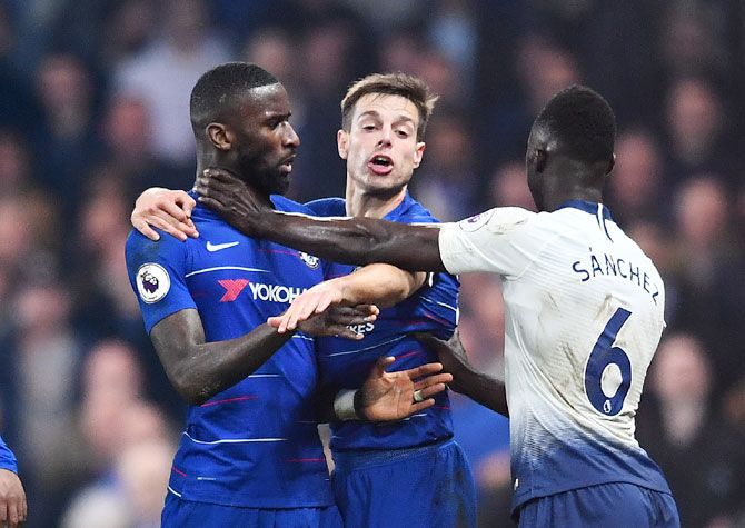 Chelsea's Cesar Azpilicueta intervenes as Tottenham Hotspur's Davinson Sanchez and Chelsea's Antonio Ruediger clash during their match at Stamford Bridge in London
