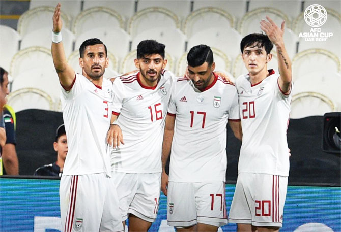 Iran players celebrate after scoring a goal against Yemen on Monday