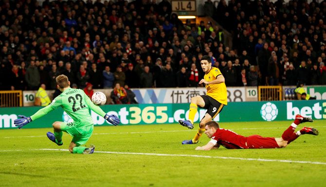 Wolverhampton Wanderers' Raul Jimenez scores their openning goal against Liverpool