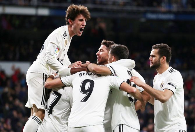Real Madrid's Alvaro Odriozola and teammates celebrate after Lucas Vazquez scored the second goal against Leganes in their King's Cup Round of 16 first leg match at the Santiago Bernabeu in Madrid on wednesday