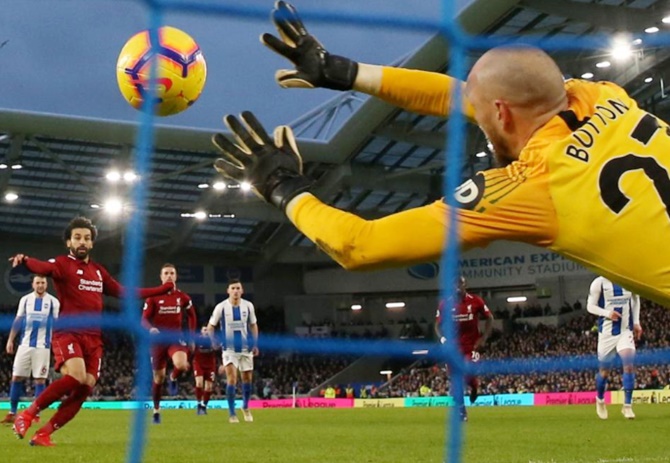  Liverpool's Mohamed Salah scores from the penalty spot.