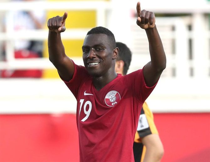 Qatar's Almoez Ali celebrates after scoring against North Korea on Sunday