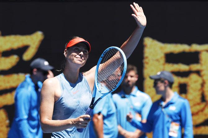 Russia's Maria celebrates on winning her first round match against Britain's Harriet Dart