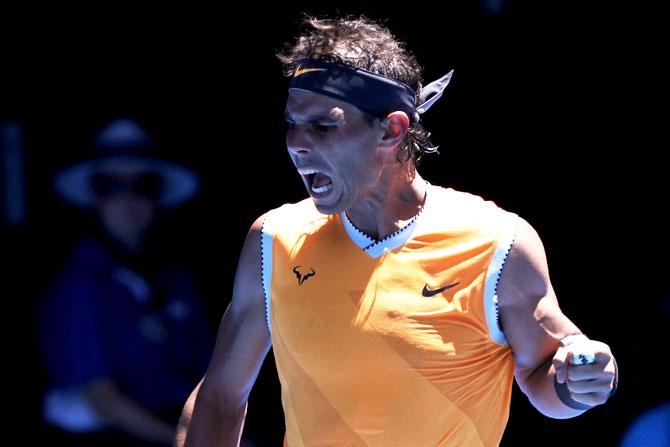 Spain's Rafael Nadal celebrates after winning a point against Australia's James Duckworth during their first round match at the Rod Laver Arena