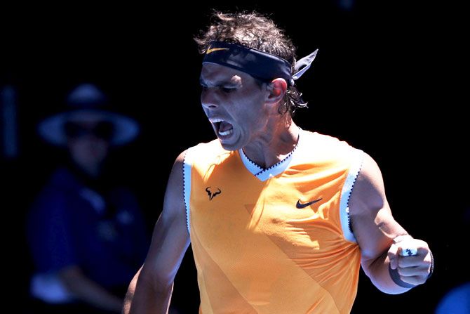 Spain's Rafael Nadal celebrates after winning a point against Australia's James Duckworth during their first round match at the Rod Laver Arena