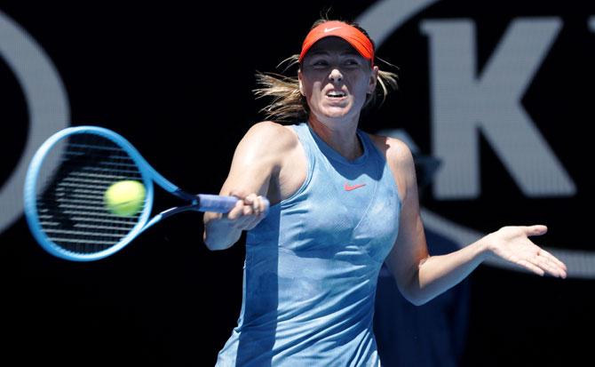 Maria Sharapova plays a return during her match against Harriet Bart