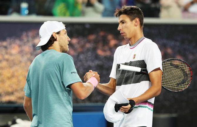 France’s Lucas Pouille is congratulated by Australia’s Alexei Popyrin after the match