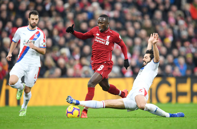 Liverpool's Naby Keita is challenged by Crystal Palace's James Tomkins