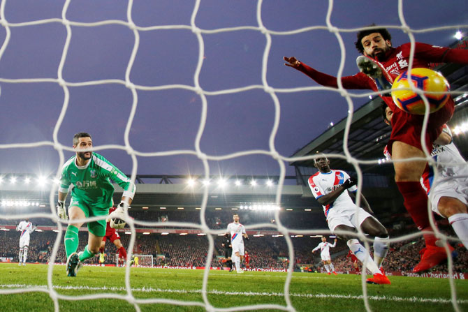 Liverpool's Mohamed Salah scores their third goal against Crystal Palace at Anfield