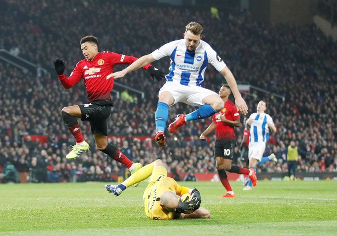 Manchester United's Jesse Lingard in action with Brighton's David Button 
