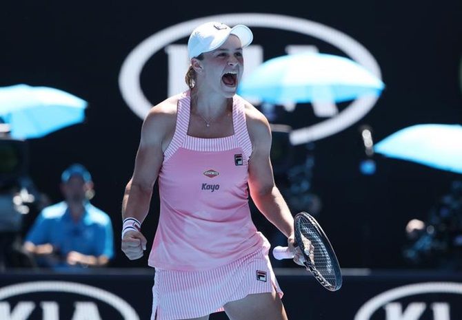 Australia's Ashleigh Barty celebrates victory over Russia's Maria Sharapova at the Australian Open in Melbourne on Sunday