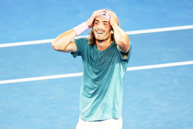 Greece's Stefanos Tsitsipas celebrates after defeating Roger Federer in the fourth round on Sunday, January 20