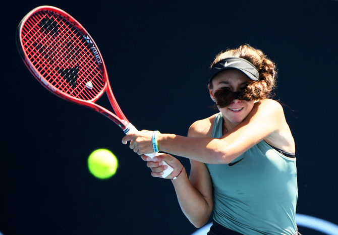 Malta's Francesca Curmi plays a backhand in her first round Junior Girls' Singles match against Australia's Annerly Poulos on Saturday, January 19