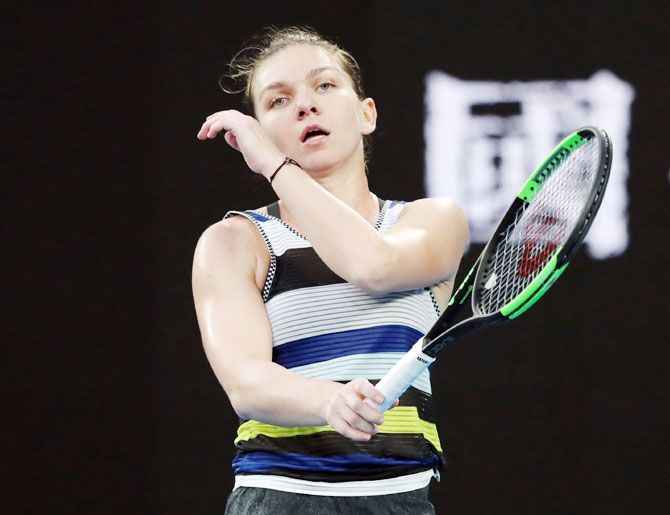 Simona Halep reacts during the match against Serena Williams