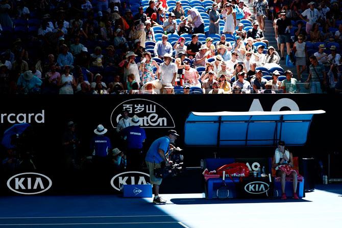 Czech Republic's Petra Kvitova waits while the roof is being closed during semi-final against USA's Danielle Collins on Thursday, January 24