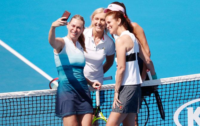 USA’s Mary Joe Fernandez, Austria’s Barbara Schett, USA’s Martina Navratilova and Slovakia’s Daniela Hantuchova pose for a selfie during their women's legends doubles match on Tuesday, January 22