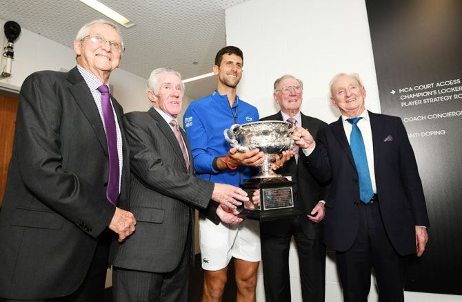 Novak Djokovic poses with Rod Laver, Frank Sedgman, Ken Rosewall and Roy Emerson (left) following his Australian Open victory against Rafael Nadal on Sunday