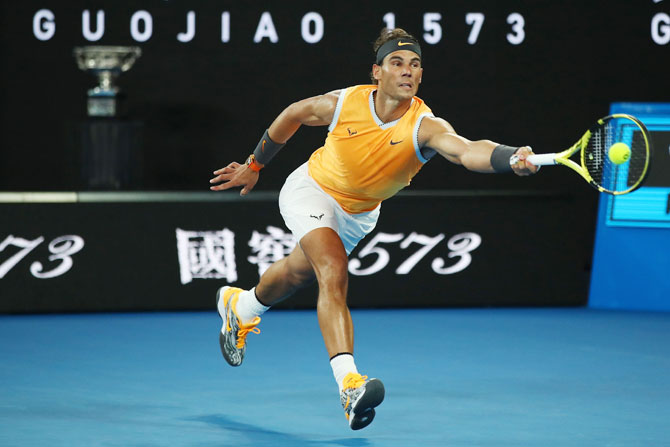 Rafael Nadal plays a forehand return