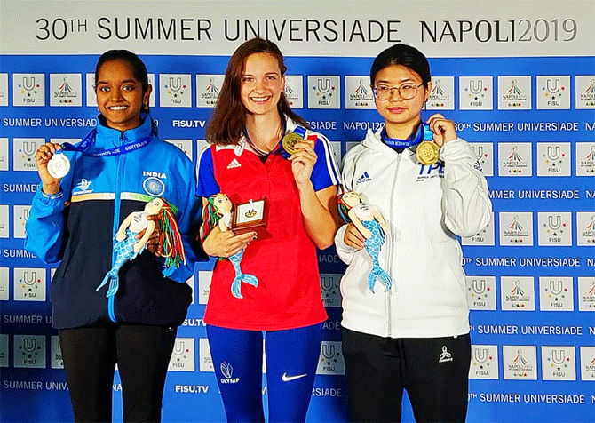 Silver-medallist, India's Elavenil Valarivan (left) is all smiles on the podium alongside gold medallist Czech Republic's Lucie Brazdova (centre) and bronze medal winner Taiwan's Ying-Shin Lin in Napoli on Thursday