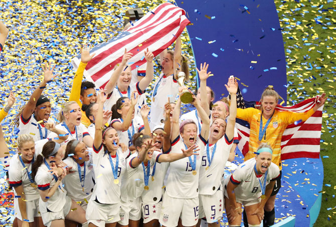 USA captain Megan Rapinoe and her team mates celebrate with the trophy on winning the Women's World Cup after defeating The Netherlands 2-0 in Lyon, France