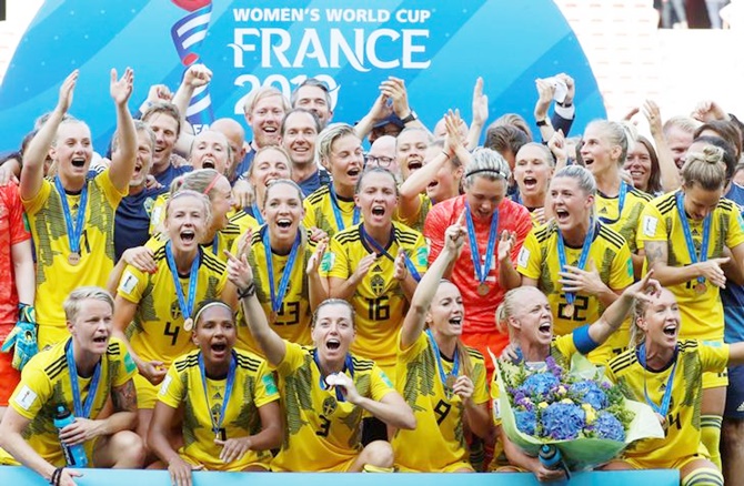 Sweden players celebrate with their medals after the third place play-off in the women's World Cup