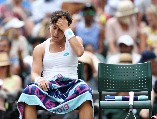 Spain's Carla Suarez Navarro reacts during her fourth round match against USA's Serena Williams