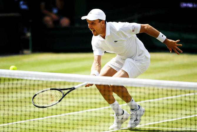 Roberto Batista Agut makes a rare foray to the net