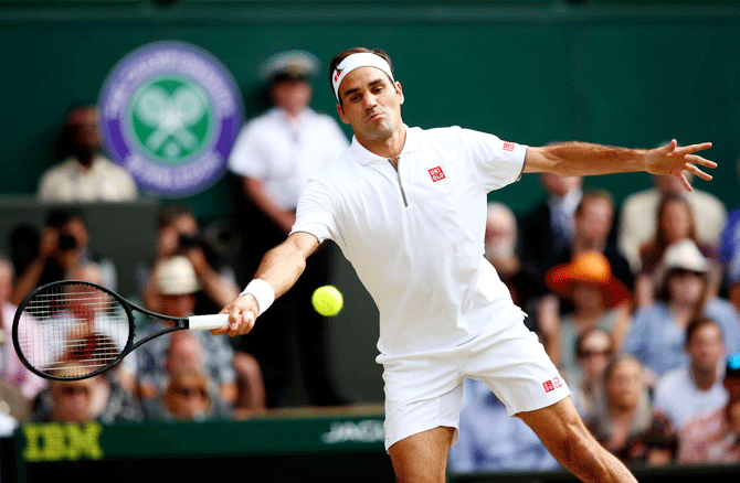 Roger Federer in action during the Wimbledon semi-final against Rafael Nadal