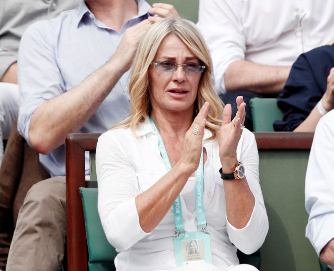 Former gymnast Nadia Comaneci in the stands watching the 2018 French Open final between Romania's Simona Halep and Sloane Stephens of the US