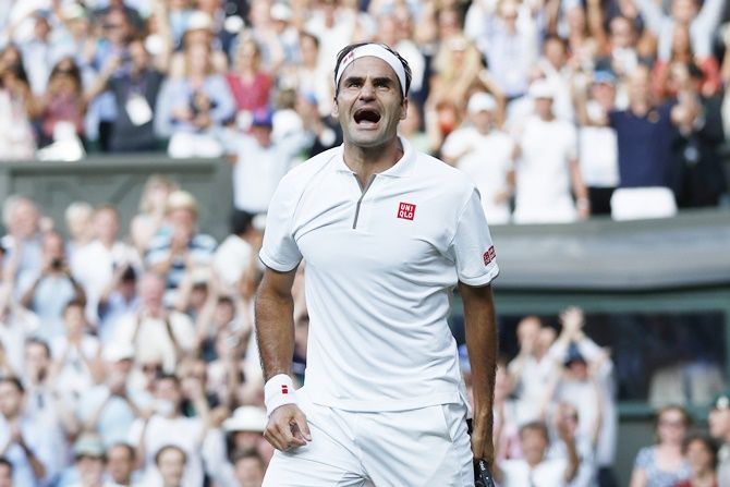 Roger Federer celebrates victory over Rafael Nadal.