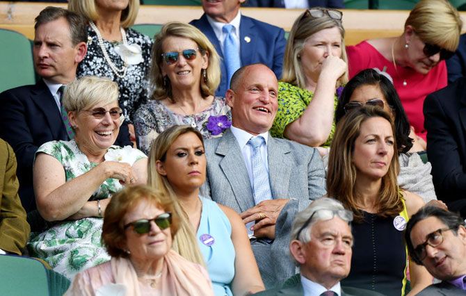 Actor Woody Harrelson enjoys the action from the Royal Box