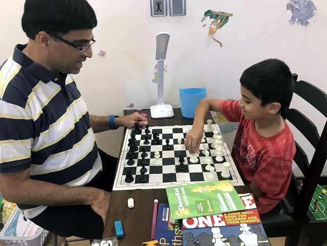 PIX: Vishy Anand celebrates International Chess Day with son - Rediff.com