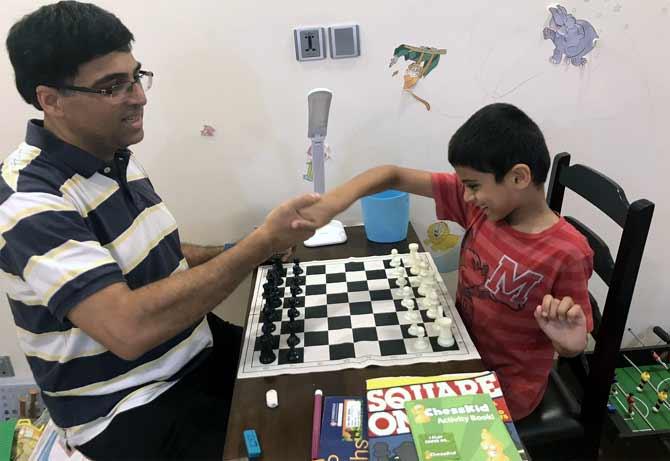 PIX: Vishy Anand celebrates International Chess Day with son - Rediff.com