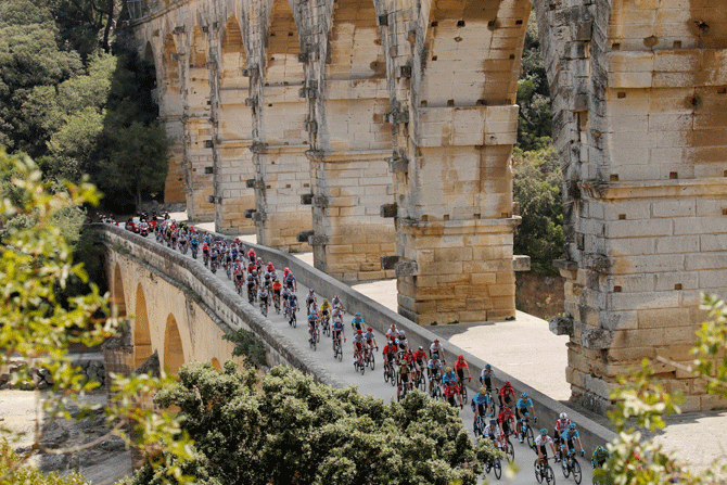 The peloton in action on the Pont du Gard at the 177-km Stage 16 from Nimes to Nimes on July 23